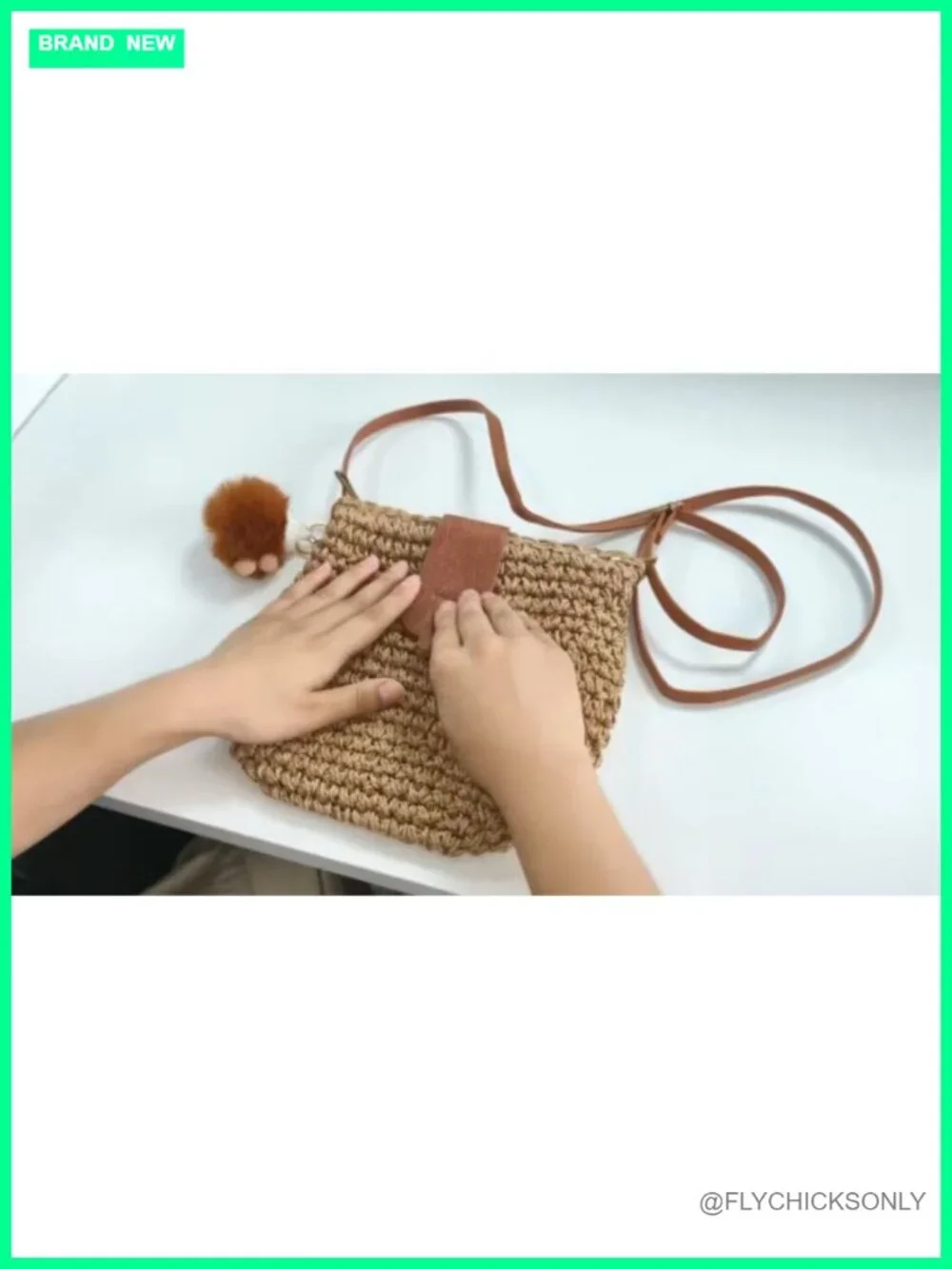 Handwoven Straw Crossbody Bag with Adjustable Strap and Pom-Pom Charm